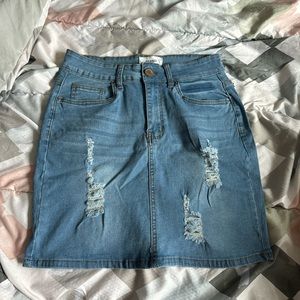 Ripped Light Blue denim skirt